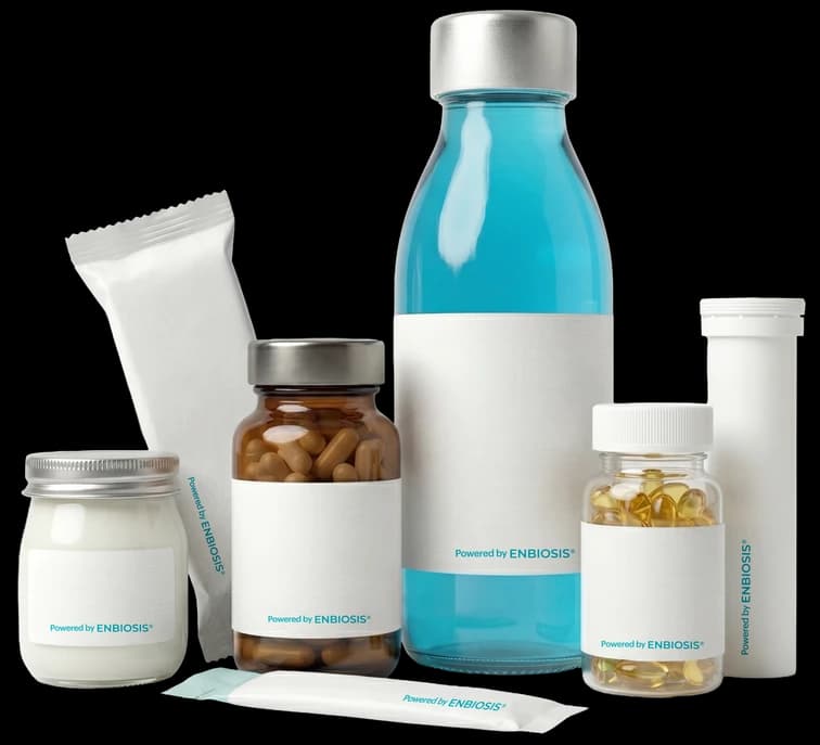 Product family labelled Powered by Enbiosis: a bottle, jars, a sachet and a tube