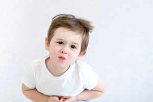 stomachache-child-white-tshirt